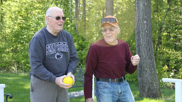 Two seniors enjoying a sunny day outdoors