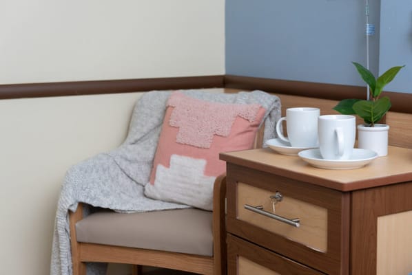 Cozy corner in a resident's room with coffee cups