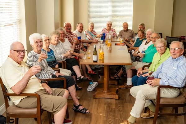 Residents enjoying drinks together in a common area