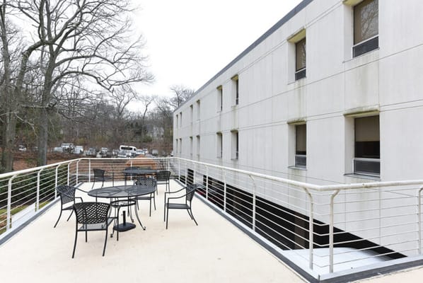 Outdoor seating area with tables and chairs