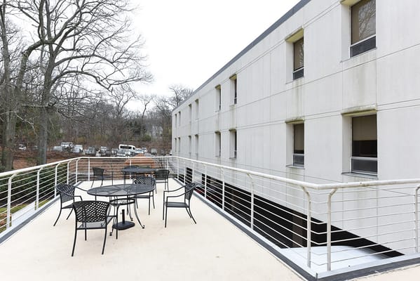 Outdoor seating area with tables and chairs