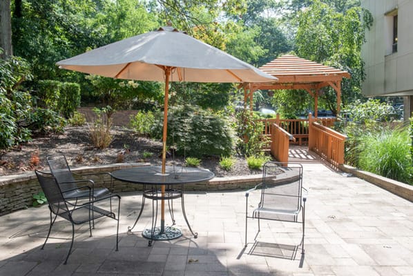 Outdoor courtyard area with seating and gazebo