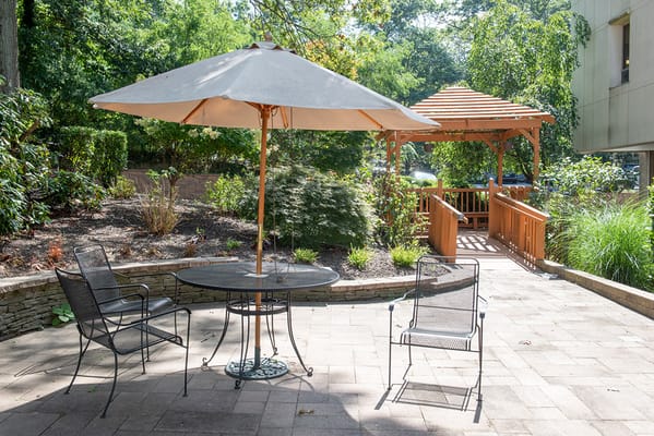 Outdoor courtyard area with seating and gazebo