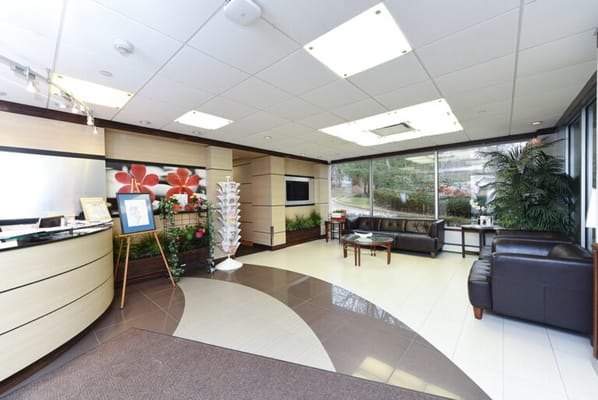 Bright lobby area with plants and seating