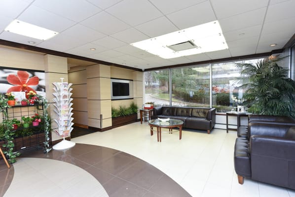 Bright lobby area with seating and plants