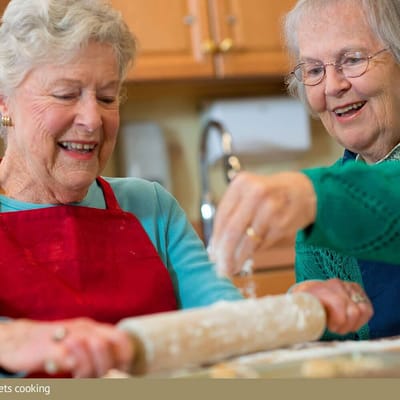 Residents baking in a well-lit kitchen