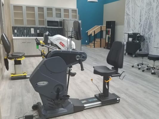 Interior view of a therapeutic exercise room with equipment