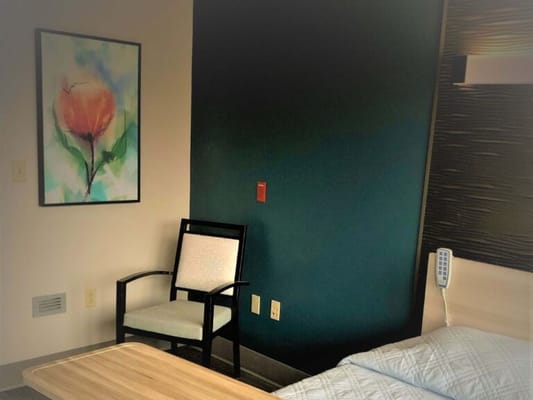 Cozy resident room with floral artwork