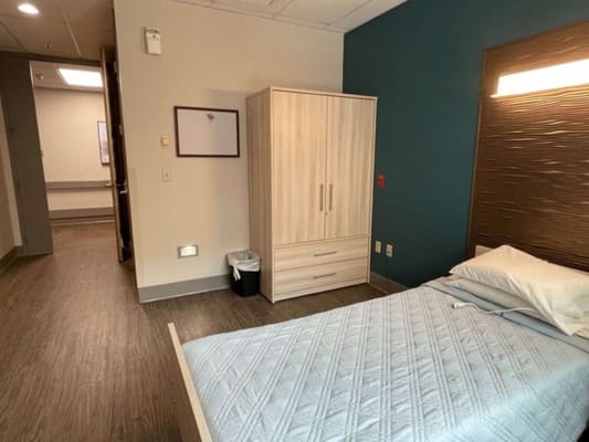 Private resident room with bed and furniture