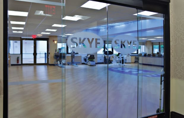 Interior view of a therapy gym with exercise equipment