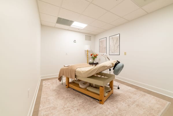 Interior massage room with a treatment table and decor
