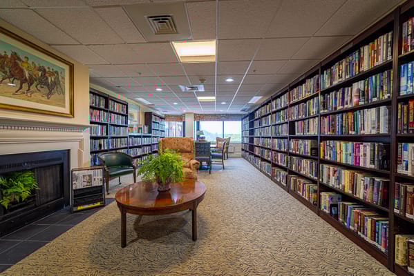 Interior library filled with books and seating area