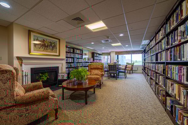 Cozy library area with bookshelves and seating