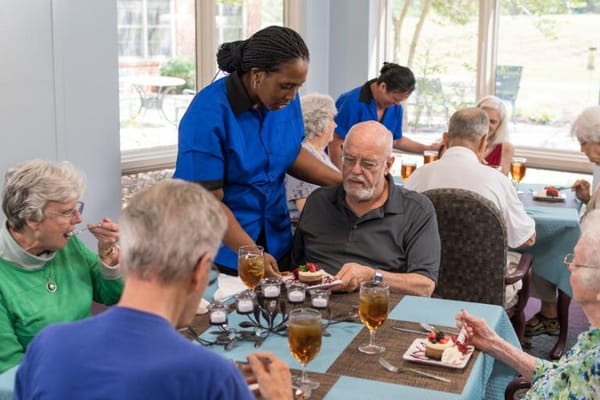 Residents enjoying a meal in the dining room