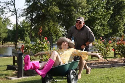 Residents enjoying time outdoors in a wheelbarrow