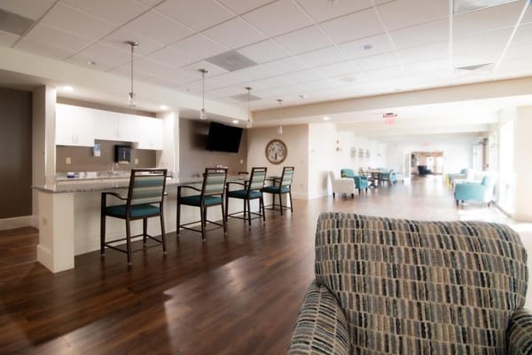 Bright common area with seating and kitchen island