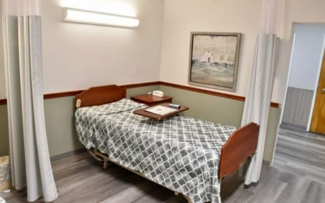 A private resident room with a bed and decor