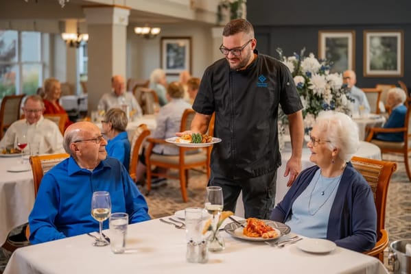 Residents enjoying a meal in the dining room