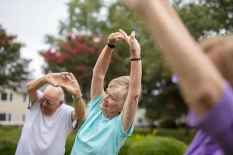 Seniors participating in an outdoor exercise class