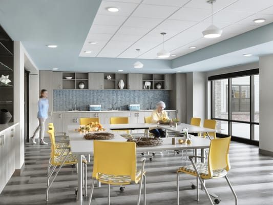 Bright common area with residents and activity space