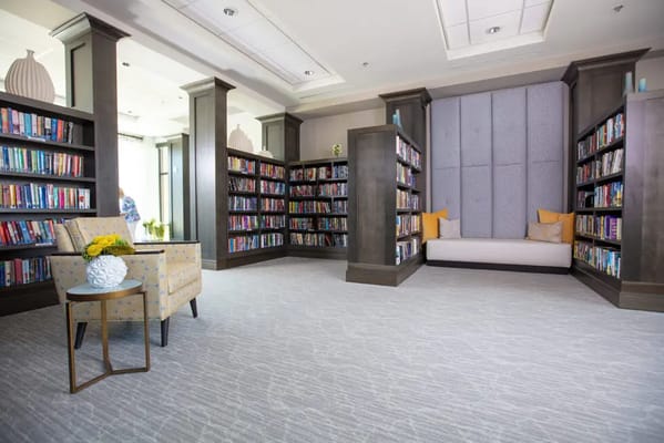Cozy library space with bookshelves and seating