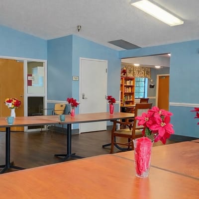 Common area with tables and flowers