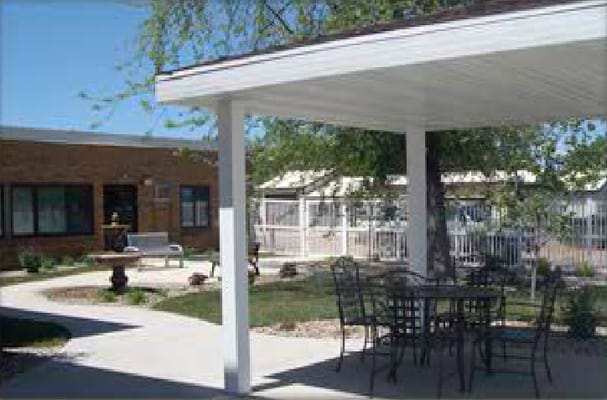 Outdoor seating area with patio and landscaping