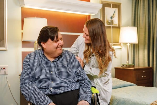 Caregiver interacting with a resident in a private room