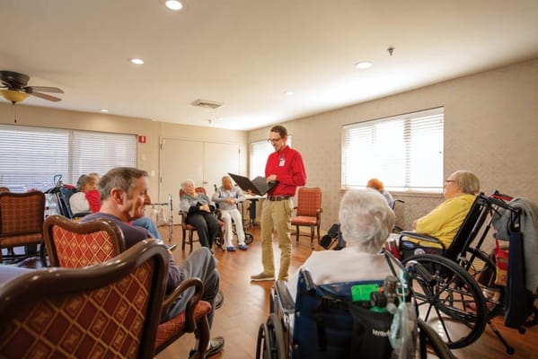 Residents participating in a group activity in a common room