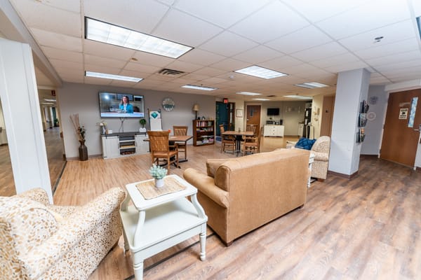 Interior common area with seating and a television