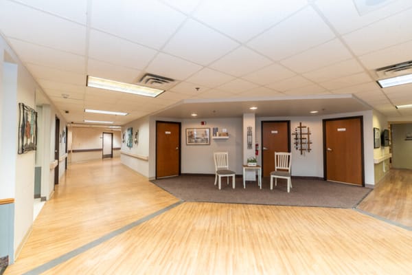 Interior hallway with seating area and doorways