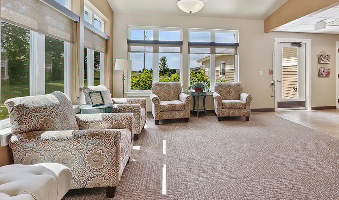 Bright common area with comfortable seating and large windows