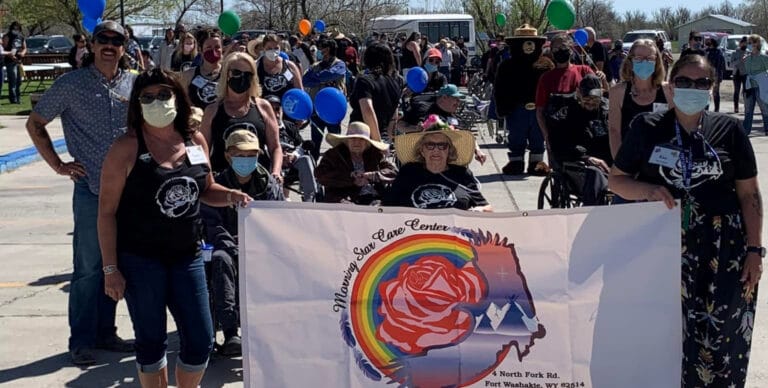 Residents and staff celebrating at an outdoor event