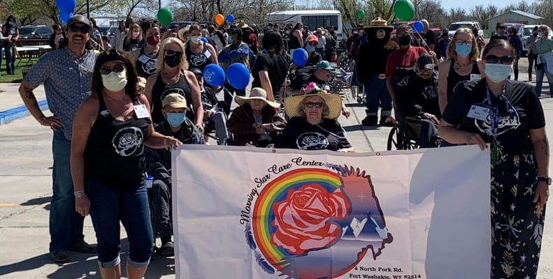 Residents and staff celebrating at an outdoor event