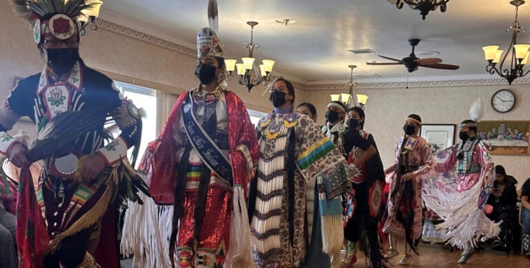 Residents participating in a cultural event indoors