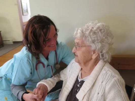 Caregiver interacting with a senior resident