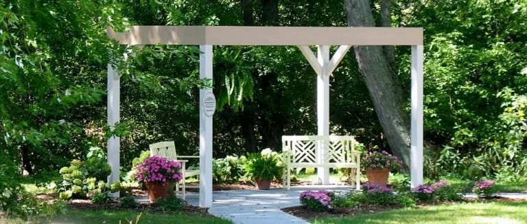 A serene outdoor gazebo surrounded by flowers