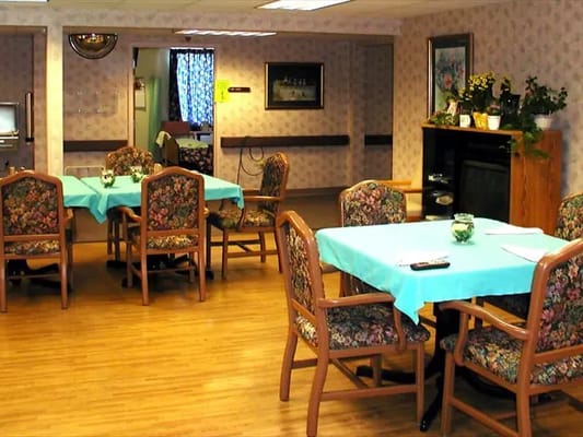 Indoor common area with tables and chairs