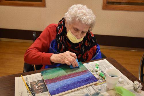 Senior resident engaged in an art activity