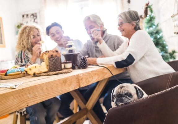 Family gathering with food at a dining table
