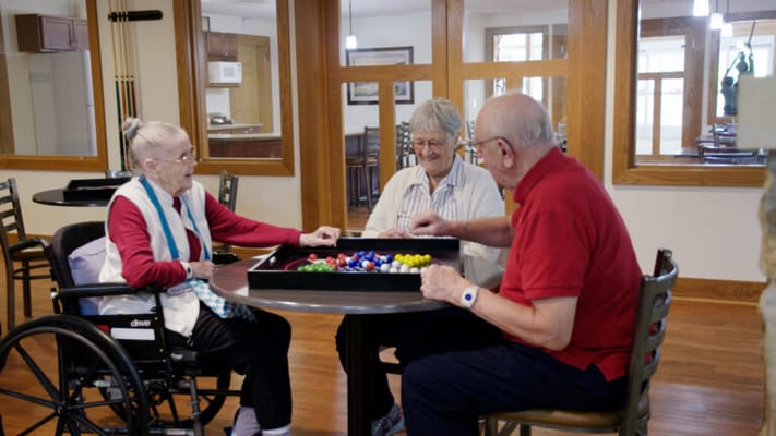 Residents engaged in a group activity in a common area