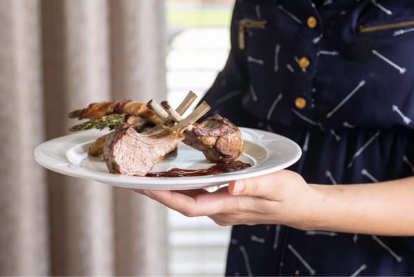 A resident enjoying a gourmet meal served on a plate