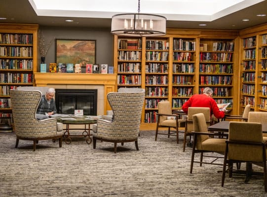 Residents enjoying a cozy reading area in the library