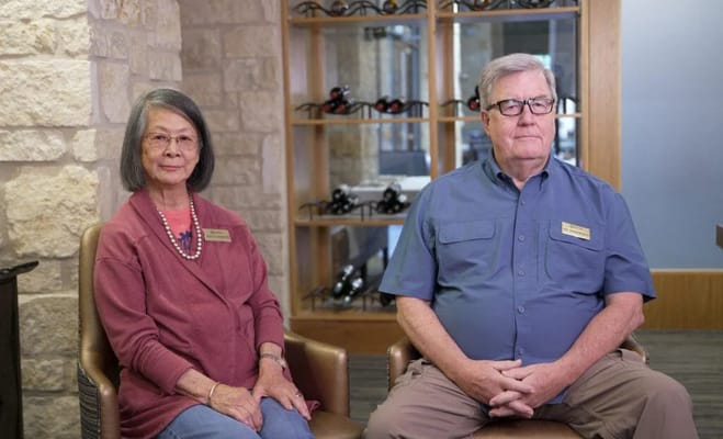 Two residents seated in a common area