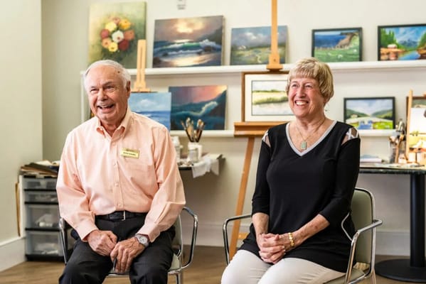 Residents participating in an art class in a bright room