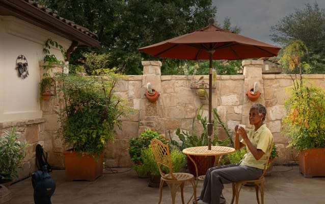 A resident enjoying a quiet moment in a garden
