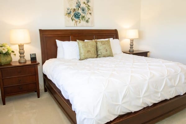 Cozy resident bedroom with floral decor and bedding