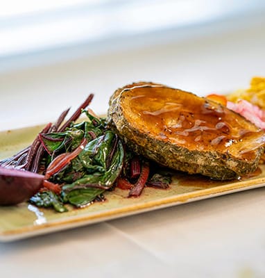 A beautifully plated meal with vegetables