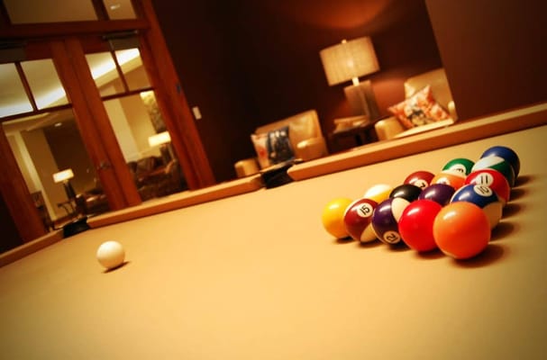 Billiard table with a set of colorful pool balls