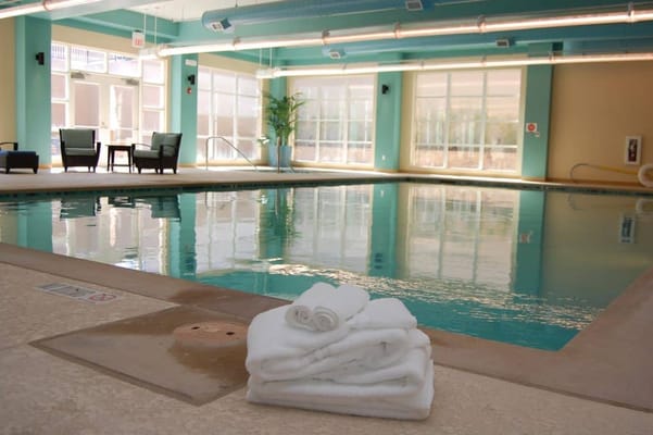 Indoor pool with towels stacked on the side